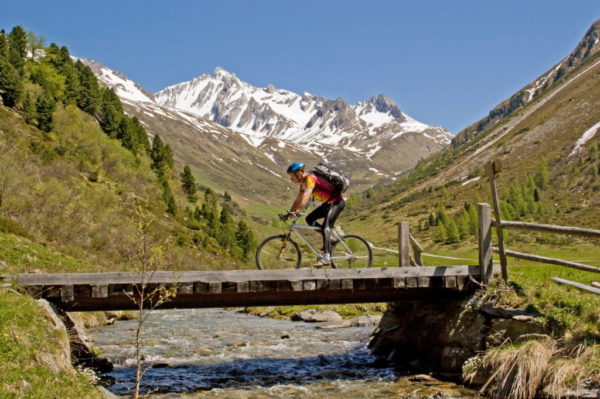 Men doing mountain biking in Tirol